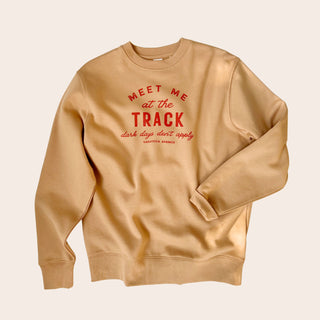 Beige sweatshirt with red text 'Meet Me at the Track - Dark Days Don't Applu text. Saratoga Springs, NY Boutique